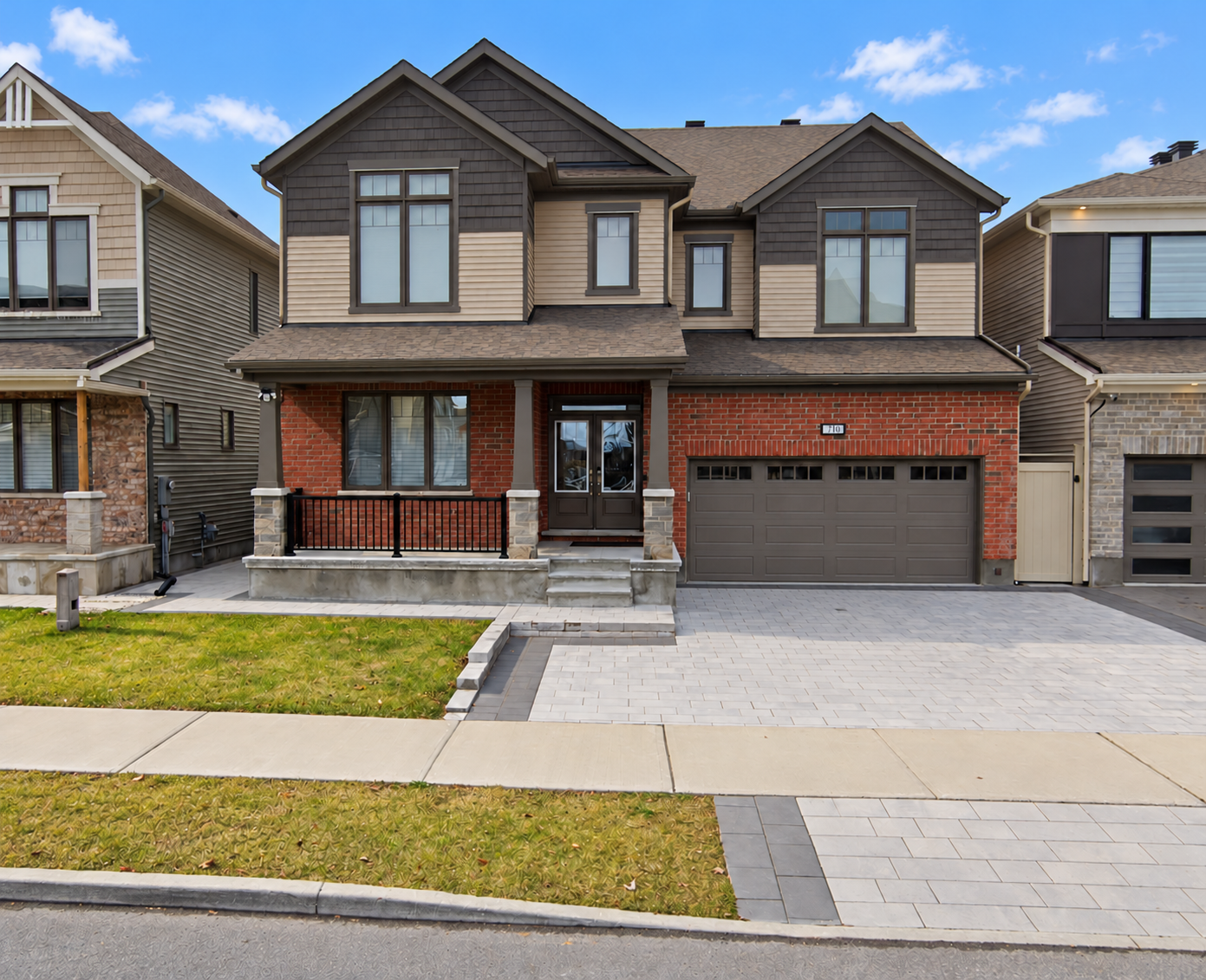 Exterior reference of 710 Rouncey Road, digitally edited to remove vehicles and brighten the weather